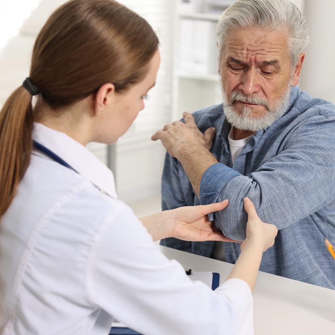 Arthritis Treatment Dubai — doctor examining patient's knee joint