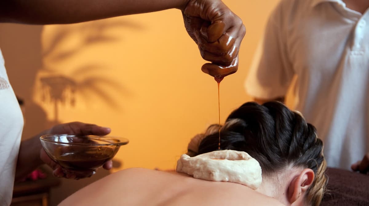 Shirodhara Ayurvedic therapy being performed at RamaCare Polyclinic Dubai