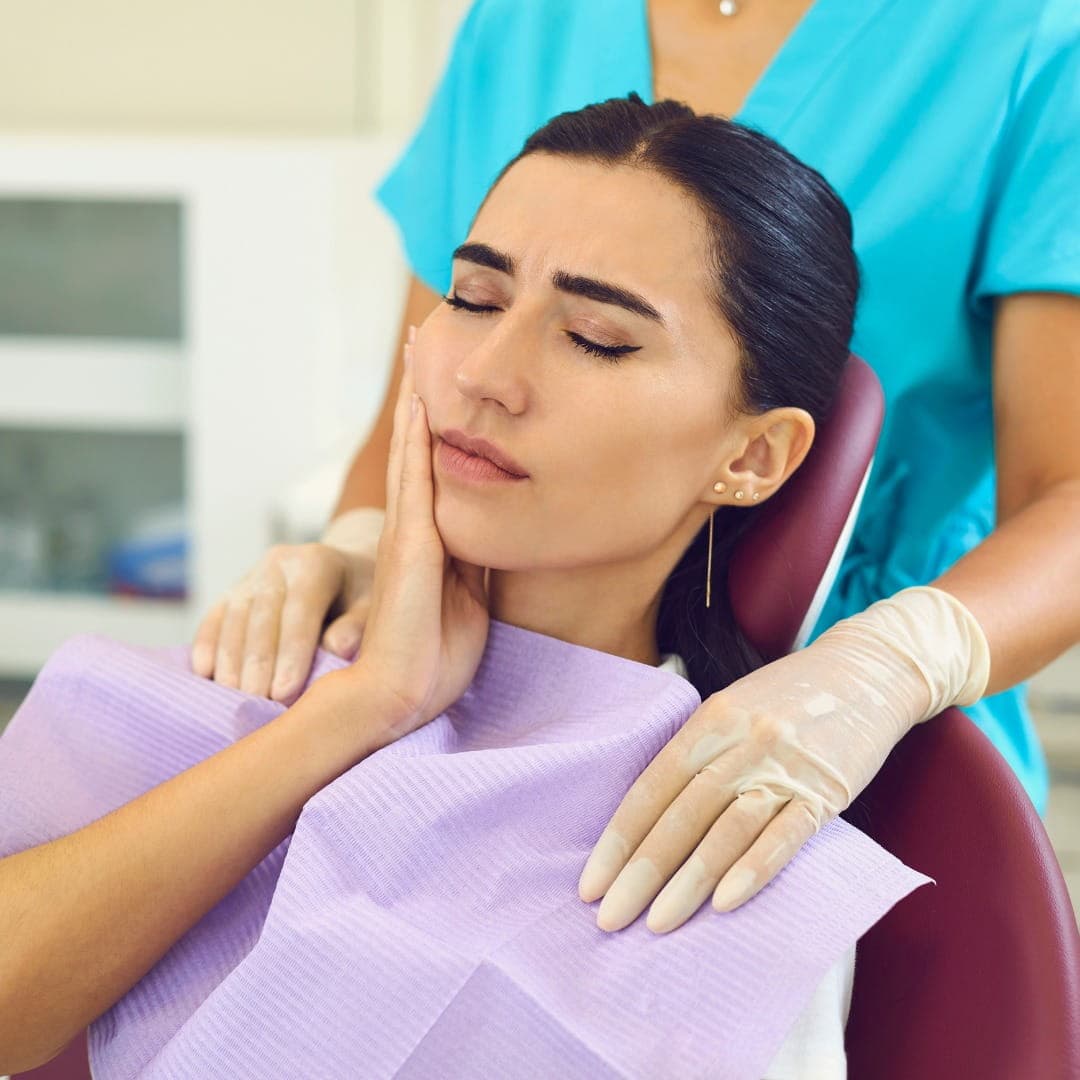 Tooth Pain Treatment Dubai - dentist examining patient at RamaCare Polyclinic