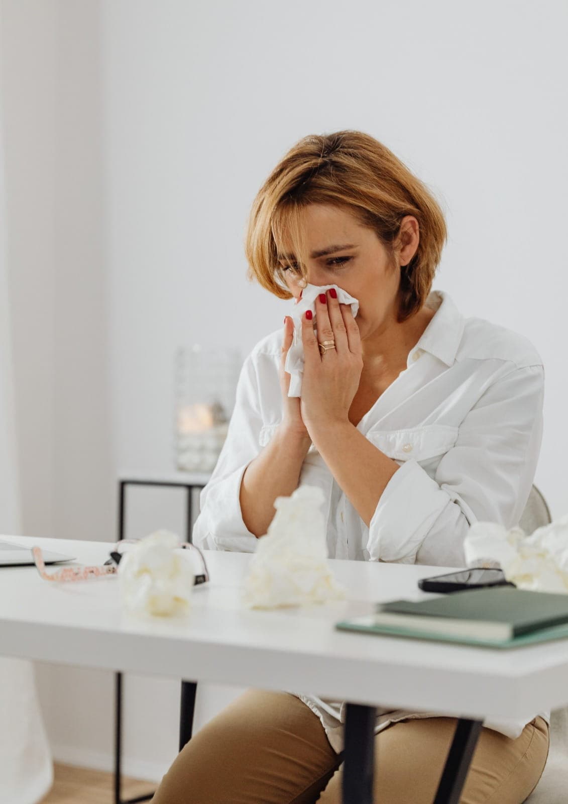 Doctor assessing allergy symptoms during a patient consultation, clean clinical setting, caring interaction, realistic healthcare scene, no text