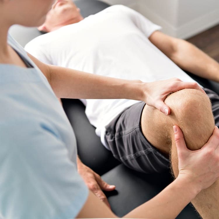 Jeena Mathew conducting a physiotherapy assessment at RamaCare Polyclinic