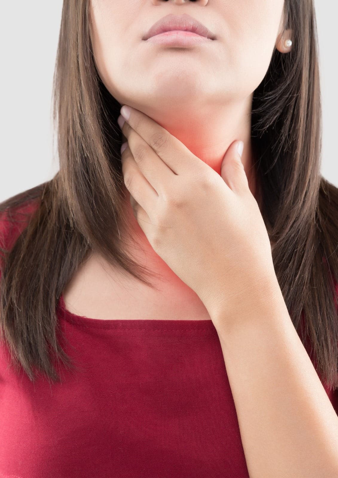 Doctor explaining thyroid health and treatment options during consultation, calm clinic atmosphere, realistic medical photography, no tex