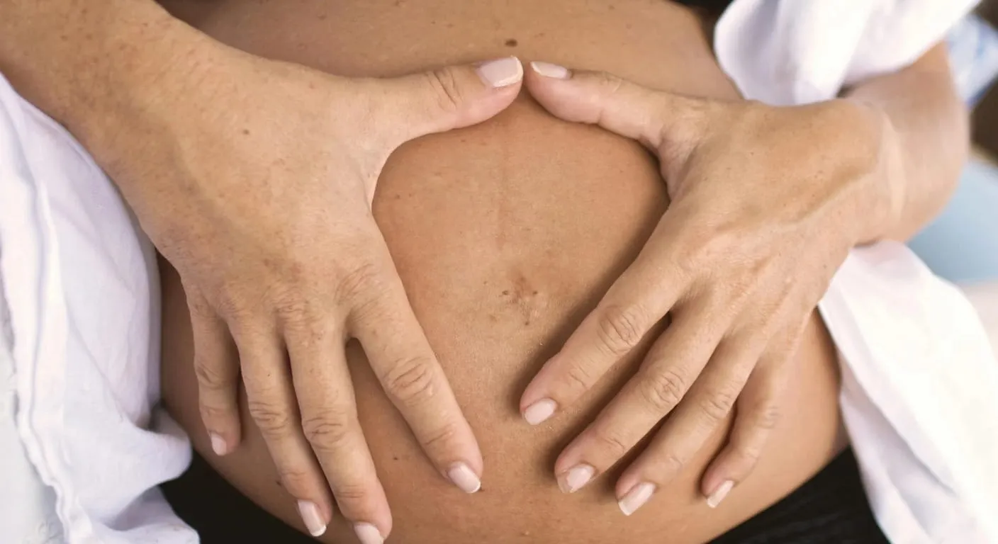 Doctor discussing postnatal recovery with a new mother
